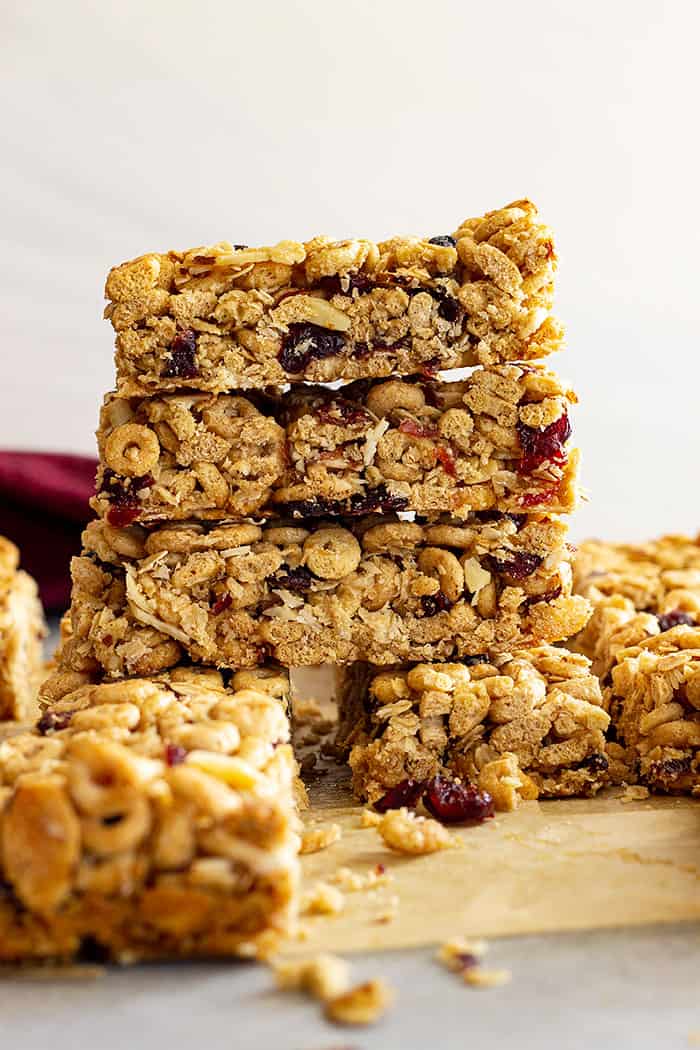 A stack of granola bars with other bars around. 