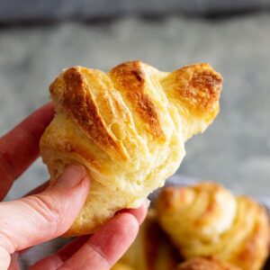 These tender and flaky homemade Crescent Rolls are perfect for your holiday meals!! They are much easier to make than croissants and so buttery! #homemaderolls #crescentrolls