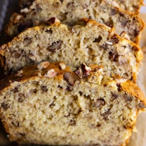 Close up of slices of banana nut bread to show the texture and nuts inside.