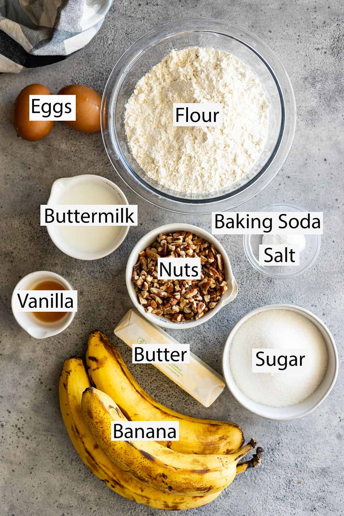Ingredients: flour, eggs, buttermilk, baking soda, salt, nuts, vanilla, butter, sugar, and bananas.