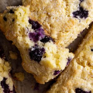 A scone broke open to show the blueberries.