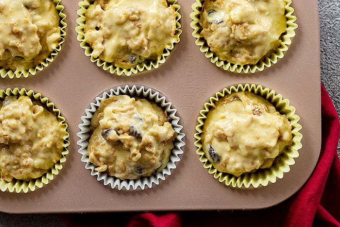 Filling the muffin tin with batter. 