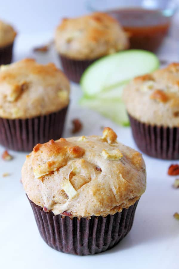 apple muffins with pecans in their muffin liners