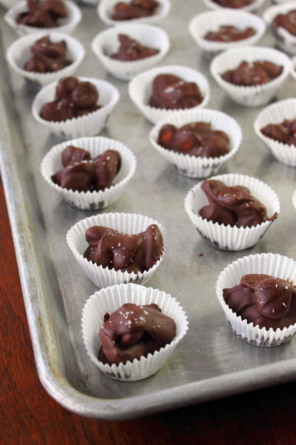 Cherry Almond Clusters in individual mini muffin liners laid out on a baking sheet