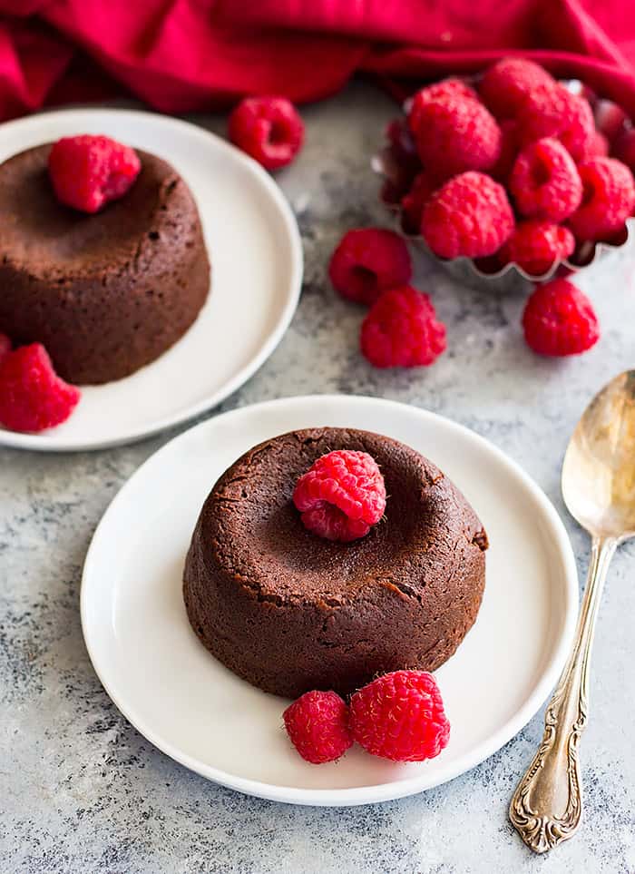 Chocolate Molten Lava Cake sprinkled with raspberries. 