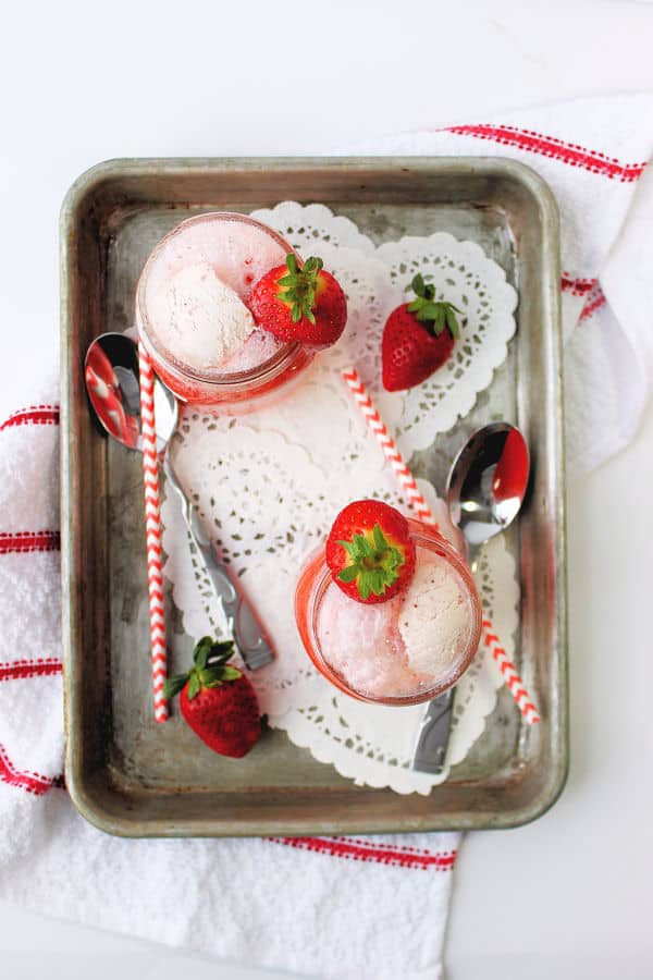 Overhead show of strawberry floats on serving platter. 