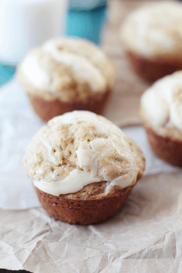 close up photo of a banana muffin with cream cheese swirled in