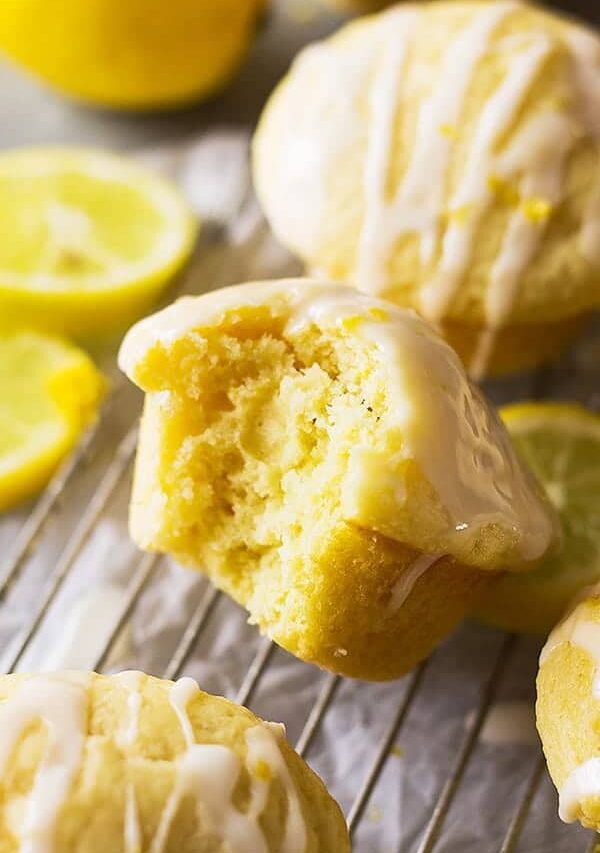 These light and airy Lemon Muffins are a great breakfast or snack! They are drizzled with a bright lemon glaze and the muffin has a bright lemon flavor!