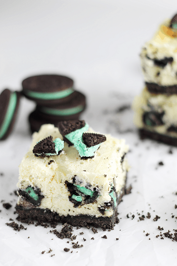 Mint Oreo Cheesecake Bars cut into squares and topped with mint oreos