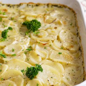 These Scalloped Potatoes are an easy side dish that can be made ahead of time! Rich and creamy and perfect for any occasion! #scallopedpotatoes #sidedishrecipe