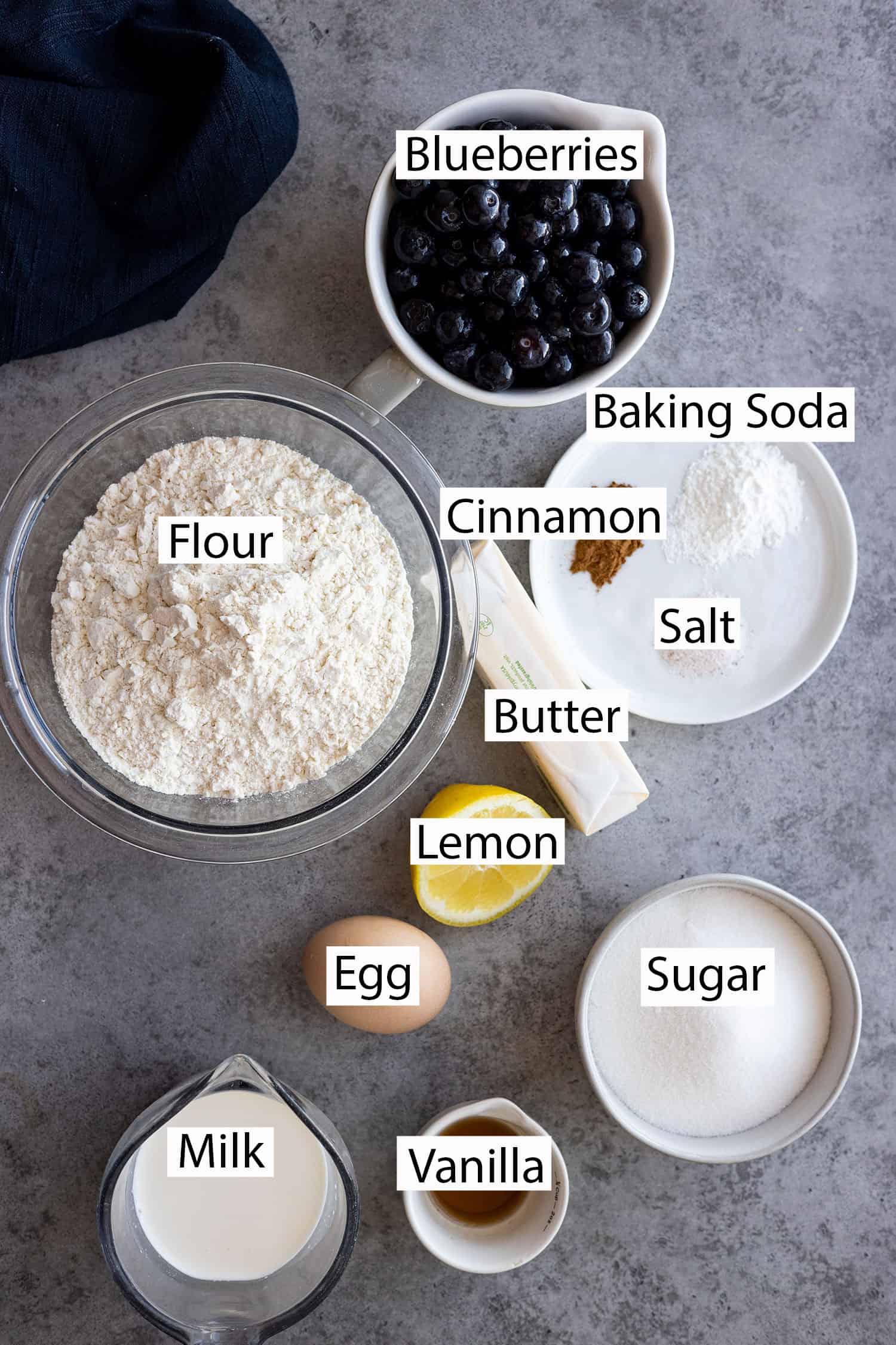 Ingredients: blueberries, flour, baking soda, cinnamon, salt, butter, lemon, egg, sugar, milk, and vanilla. 