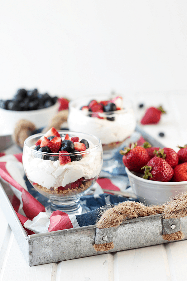 This Healthier Berry Cheesecake Parfait is a quick and easy dessert that's perfect for the 4th of July!! | Countryside Cravings