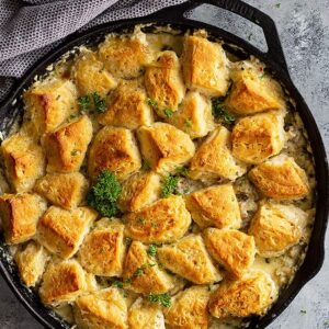 Top down view of a large pan of biscuit and gravy casserole.