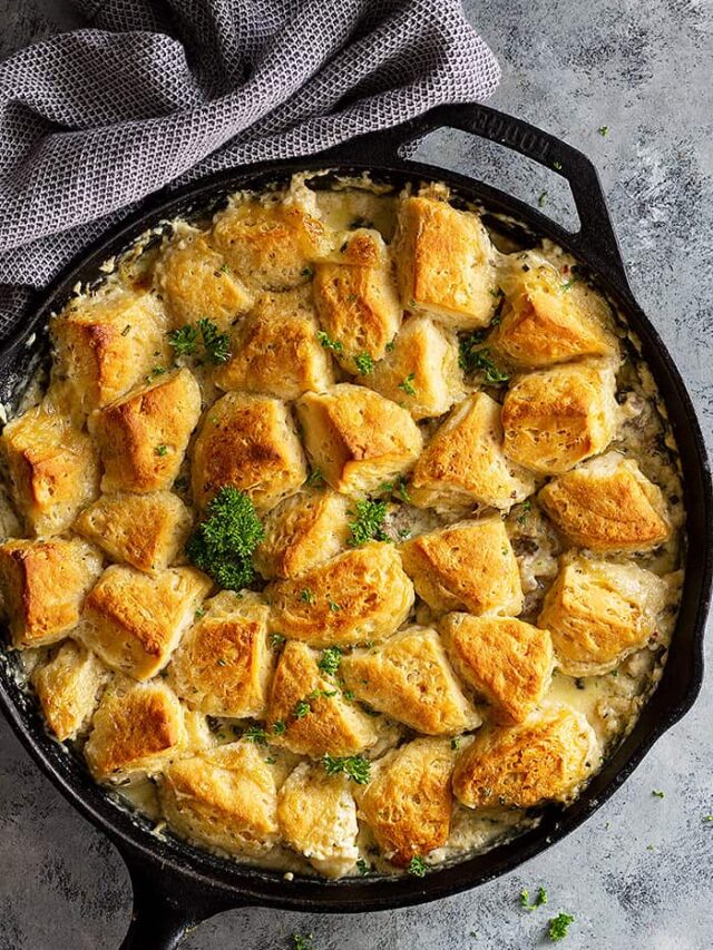 Top down view of a large pan of biscuit and gravy casserole.