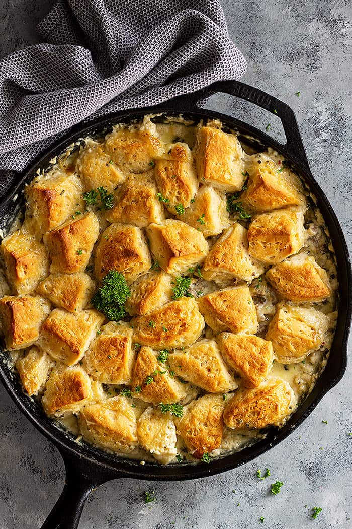 Top down view of a large pan of biscuit and gravy casserole.