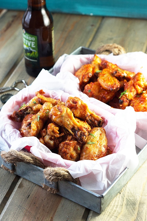 Baked Garlic Sriracha Wings- these wings are baked to crispy perfection then either coated in a garlic sriracha dry rub or sauce! | countrysidecravings.com