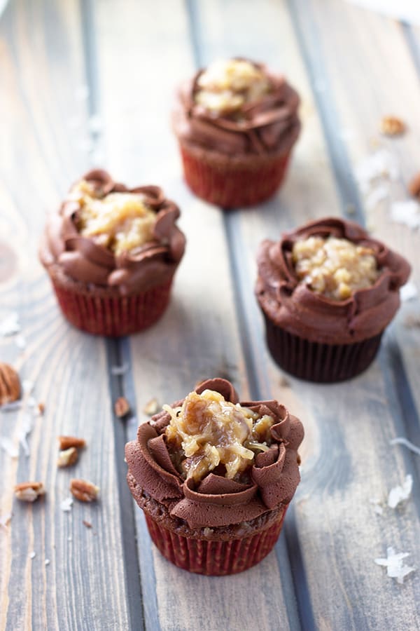 German Chocolate Cupcakes- A german chocolate cupcake topped with a caramel pecan and a sweet chocolate frosting! | Countryside Cravings