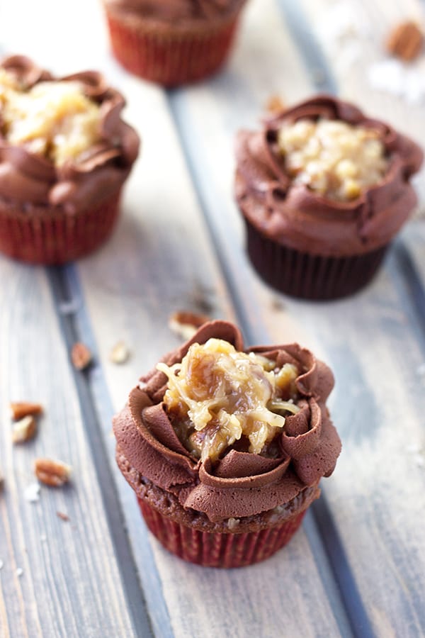 German Chocolate Cupcakes- A german chocolate cupcake topped with a caramel pecan and a sweet chocolate frosting! | Countryside Cravings