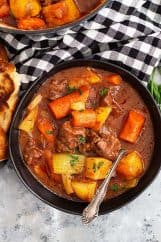 This Hearty Beef Stew is comfort food to the max! It's and easy beef stew recipe that's filled with fall apart tender beef in a wonderful hearty sauce. #beef #beefstew #easyrecipe #slowcooker