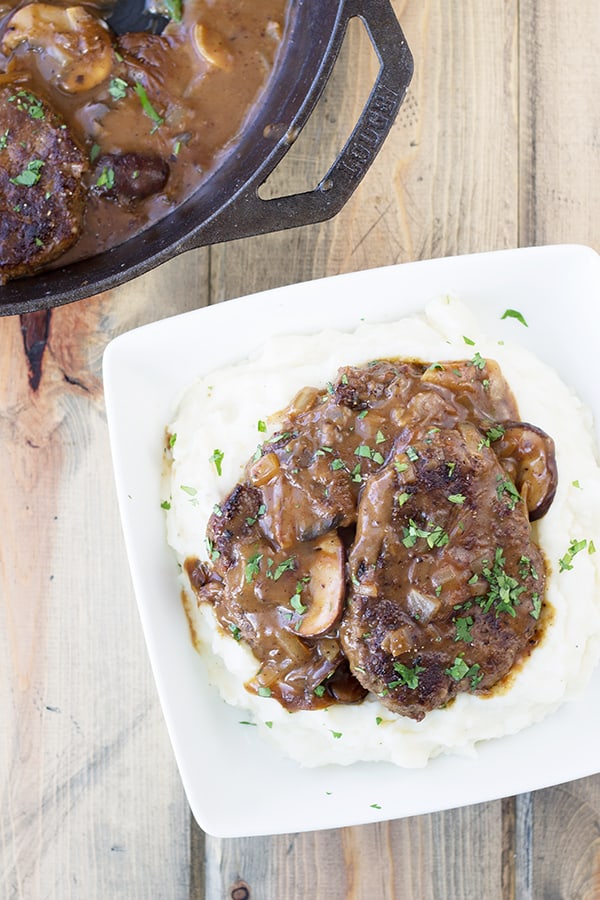 Salisbury Steak with Mushrooms and Creamy Mashed Potaotes- This is classic comfort food, but I promise it tastes way better than frozen or what you may remember from your school cafeteria! Serve it with the creamy mashed potatoes and you have a wonderfully satisfying meal! | Countryside Cravings