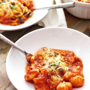 Cheesy Baked Gnocchi with Chicken- this dish is the ultimate comfort food! Loaded with melted cheese, chicken and fluffy gnocchi. | countrysidecravings.com