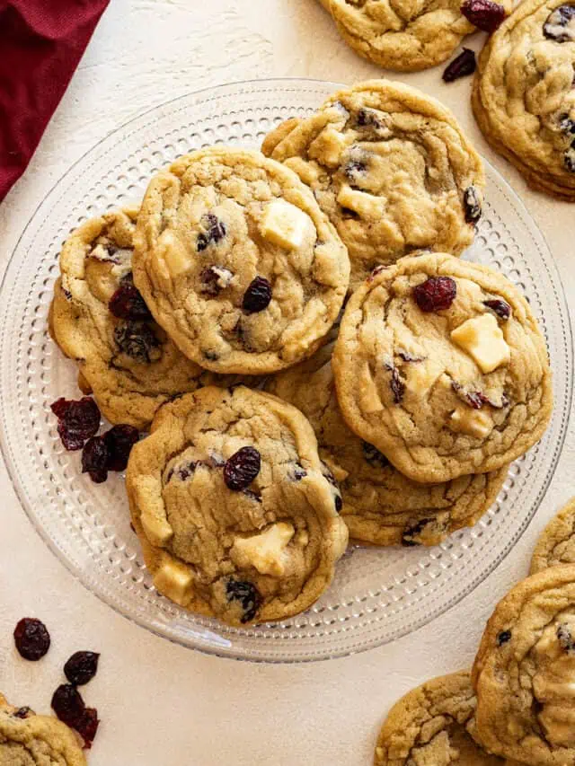 Overhead view of cookies on a plate. Cookies and red napkin in the corners.