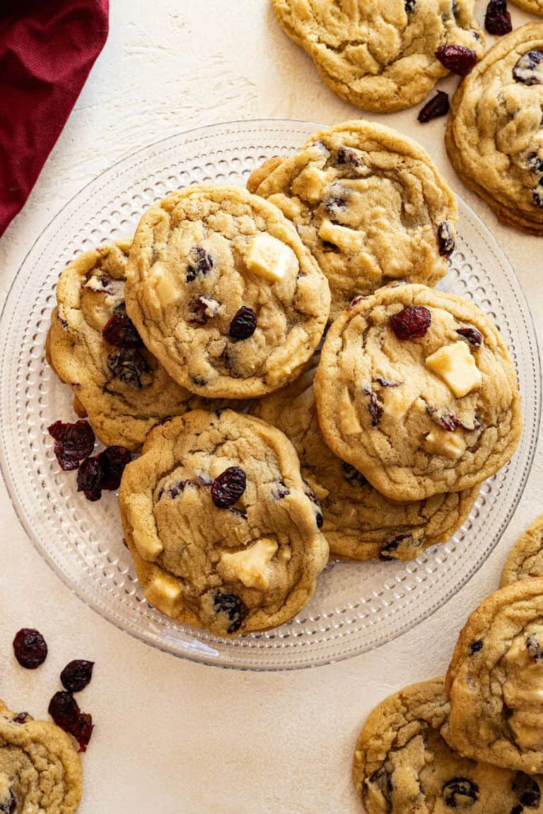 Overhead view of cookies on a plate. Cookies and red napkin in the corners.