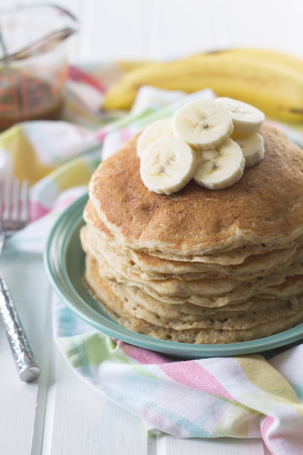 Banana Pancakes with Cinnamon Caramel Syrup -these pancakes are light, fluffy and full of banana flavor. Drizzle with the easy cinnamon caramel syrup and you have an extra special breakfast! | countrysidecravings.com