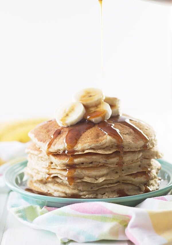 Banana Pancakes with Cinnamon Caramel Syrup -these pancakes are light, fluffy and full of banana flavor. Drizzle with the easy cinnamon caramel syrup and you have an extra special breakfast! | countrysidecravings.com