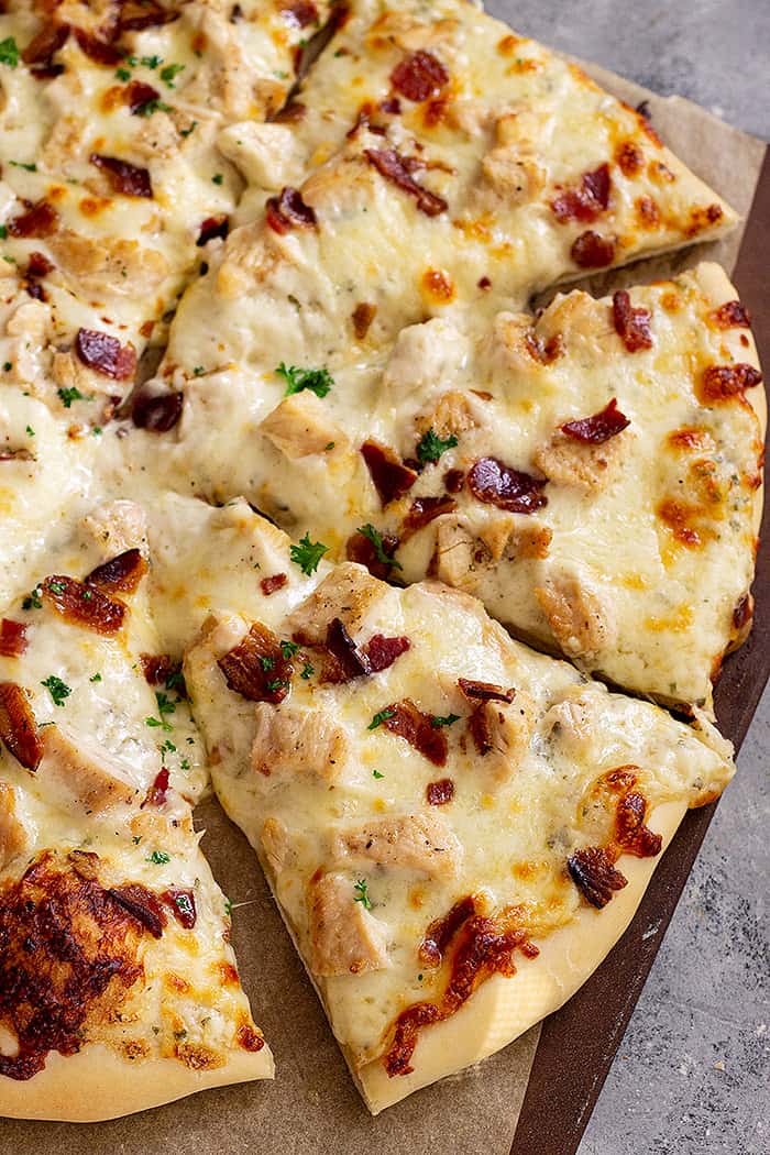 Slices of chicken bacon ranch pizza ready for eating. 