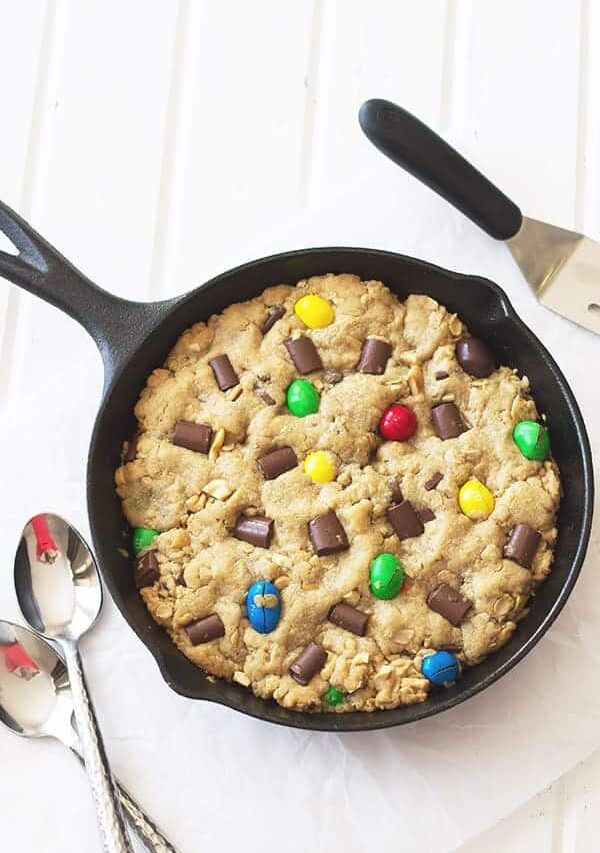 Monster Skillet Cookie -this pizookie is full of M&M's, chocolate chunks, peanuts and all wrapped up in an ooey gooey cookie! | countrysidecravings.com