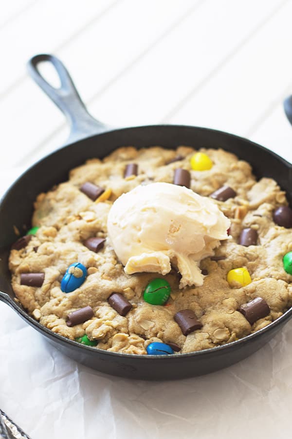 Monster Skillet Cookie -this pizookie is full of M&M's, chocolate chunks, peanuts and all wrapped up in an ooey gooey cookie! | countrysidecravings.com