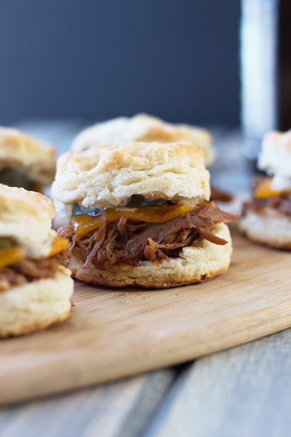 BBQ Pulled Pork Biscuit Sliders -perfect little sandwiches with smokey pulled pork, melted cheddar and Dijon mustard. | countrysidecravings.com