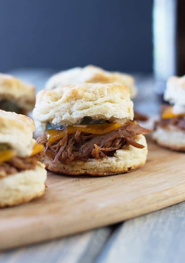 BBQ Pulled Pork Biscuit Sliders -perfect little sandwiches with smokey pulled pork, melted cheddar and Dijon mustard. | countrysidecravings.com