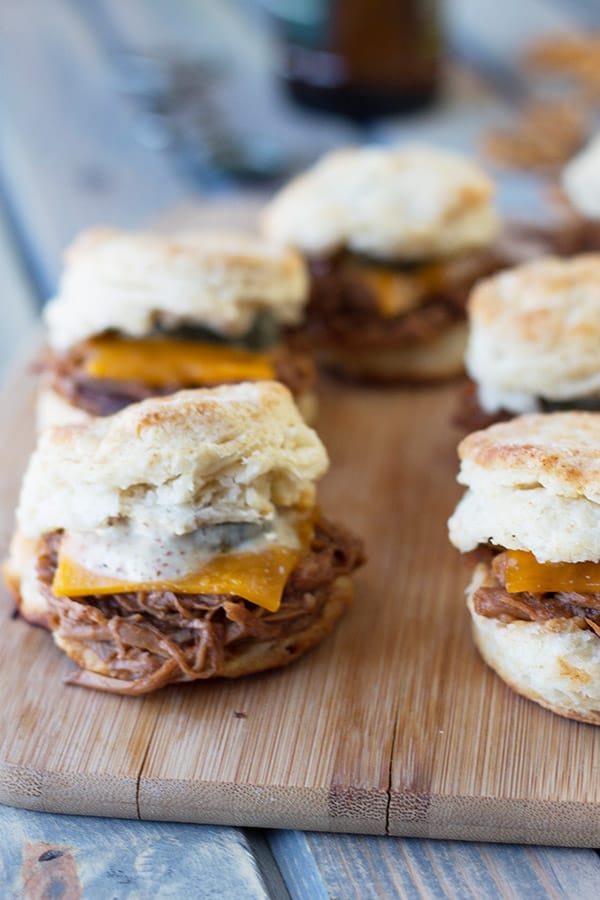 BBQ Pulled Pork Biscuit Sliders -perfect little sandwiches with smokey pulled pork, melted cheddar and Dijon mustard. | countrysidecravings.com