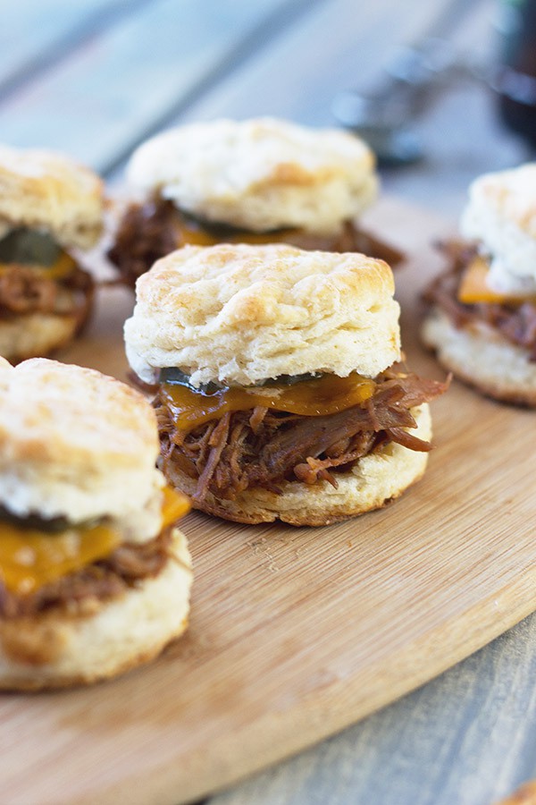 BBQ Pulled Pork Biscuit Sliders -perfect little sandwiches with smokey pulled pork, melted cheddar and Dijon mustard. | countrysidecravings.com