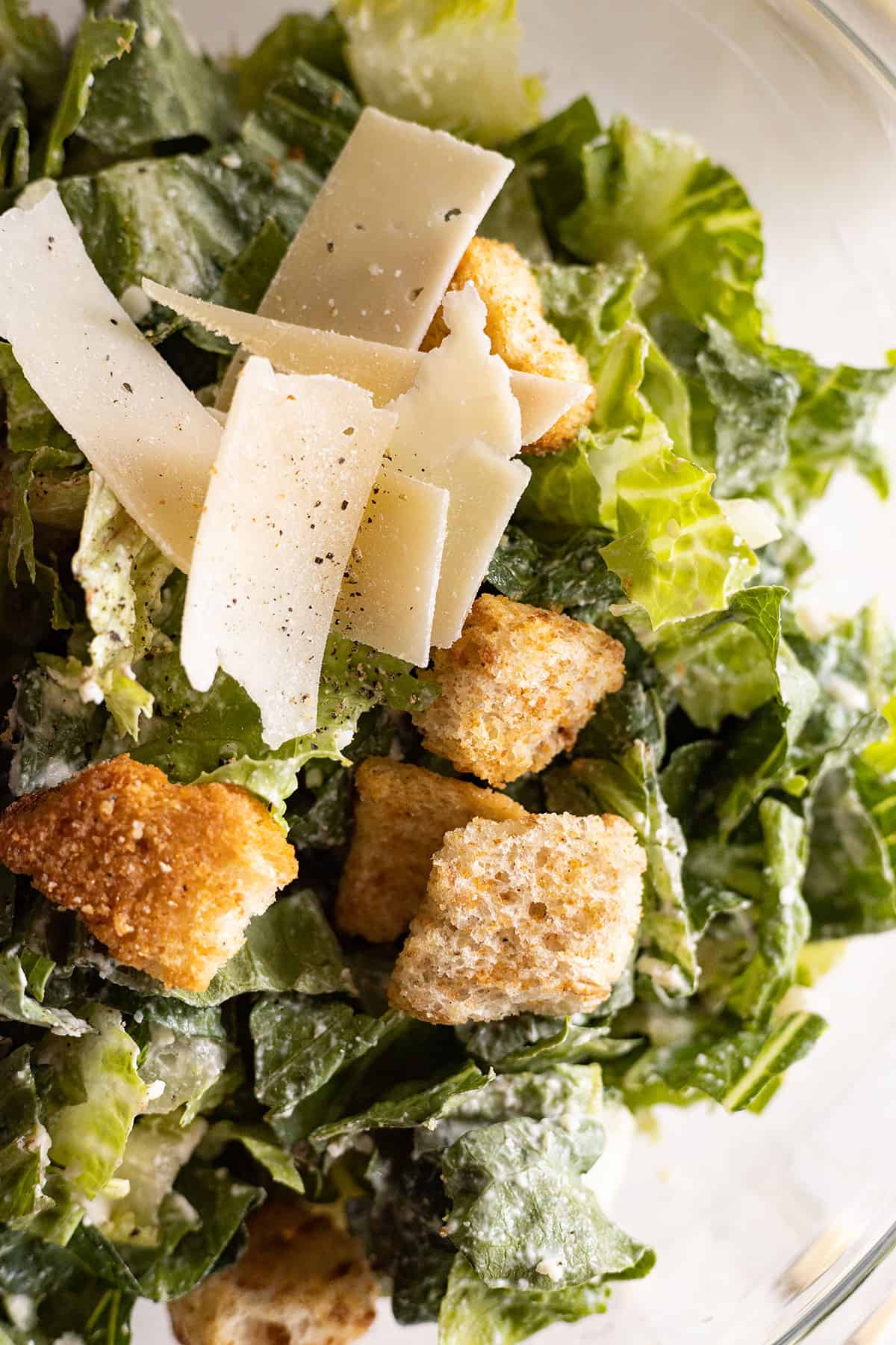 Close up of Easy Caesar Salad with croutons and parmesan. 