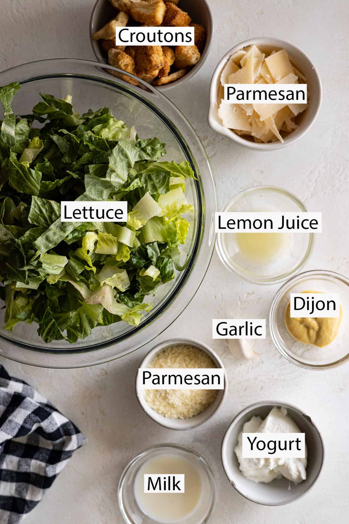Ingredients: Lettuce, croutons, parmesan, lemon juice, dijon, garlic, yogurt, and milk.