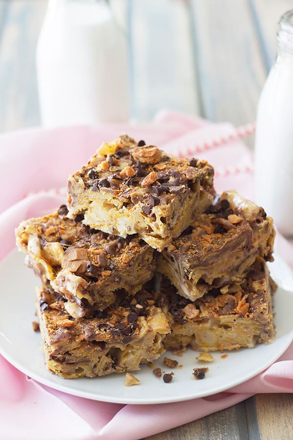 frito dessert bars cut into squares and stacked on a white plate