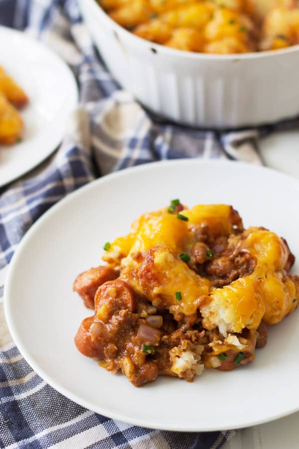 Chili Dog Tater Tot Casserole is a twist on a family favorite recipe. Chili, cheese, hot dogs, tater tots....need I say more?!?! | www.countrysidecravings.com