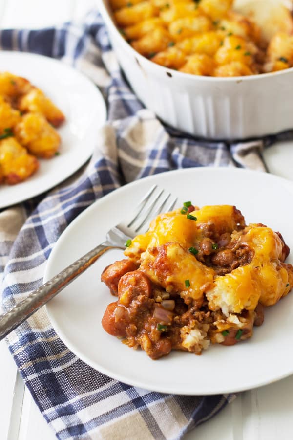 Chili Dog Tater Tot Casserole is a twist on a family favorite recipe. Chili, cheese, hot dogs, tater tots....need I say more?!?! | www.countrysidecravings.com