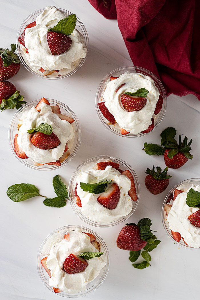 Overhead shot of several cups with red napkin in corner.