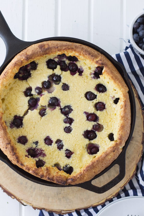 Blueberry Dutch Baby with Lemon Curd is an impressive yet very simple breakfast for any occasion! And topped with lemon curd just sends it over the top!! | www.countrysidecravings.com