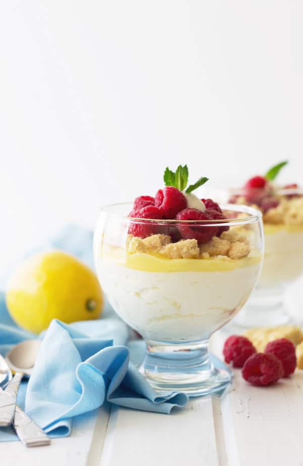 Lemon Mousse Dessert Cups -a super quick dessert that uses lemon curd. Light and airy lemony mousse, shortbread cookies and fresh raspberries make this a delicious after meal treat! | www.countrysidecravings.com