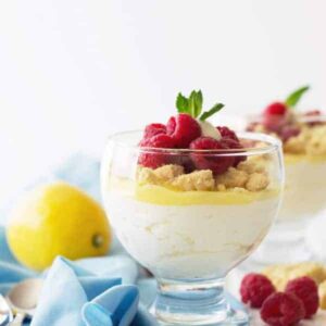 Lemon Mousse Dessert Cups -a super quick dessert that uses lemon curd. Light and airy lemony mousse, shortbread cookies and fresh raspberries make this a delicious after meal treat! | www.countrysidecravings.com
