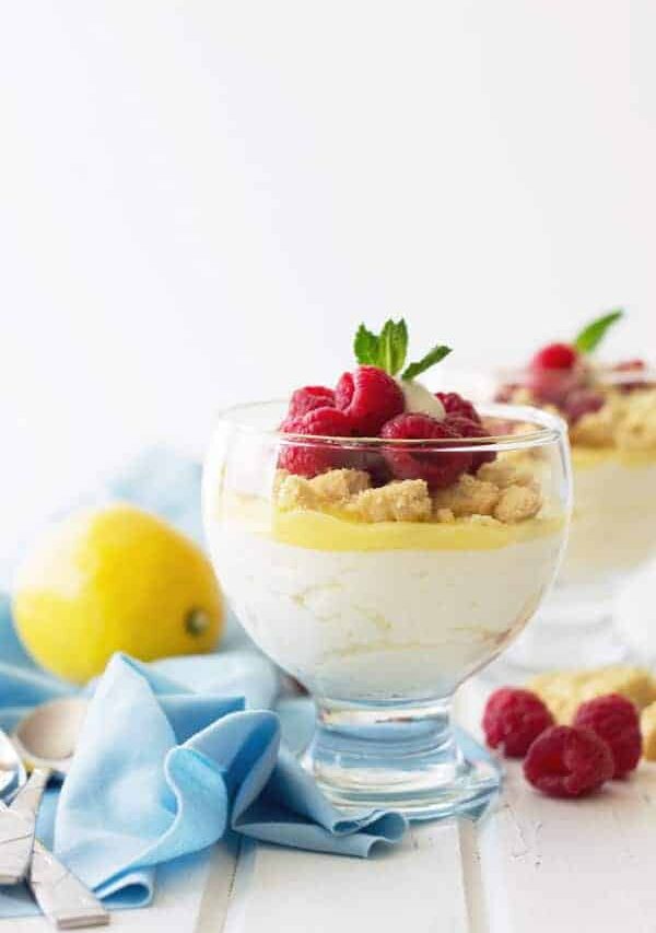 Lemon Mousse Dessert Cups -a super quick dessert that uses lemon curd. Light and airy lemony mousse, shortbread cookies and fresh raspberries make this a delicious after meal treat! | www.countrysidecravings.com