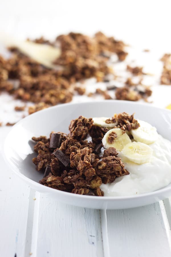 Chocolate Peanut Butter Granola that is super easy to make, great for snacking and it makes huge clusters!! | www.countrysidecravings.com