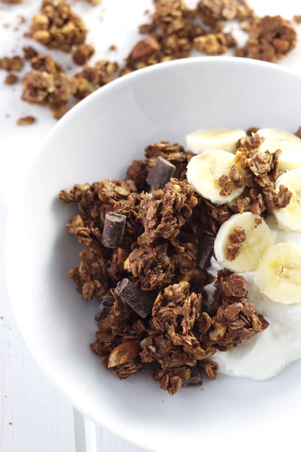 Chocolate Peanut Butter Granola that is super easy to make, great for snacking and it makes huge clusters!! | www.countrysidecravings.com