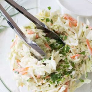 Creamy Coleslaw is a simple salad that can be made in 15 minutes or less. | www.countrysidecravings.com