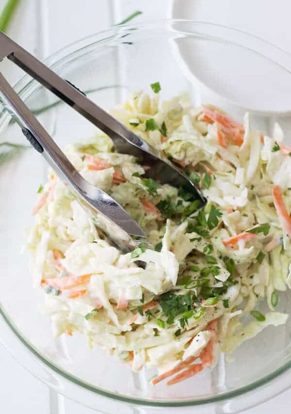 Creamy Coleslaw is a simple salad that can be made in 15 minutes or less. | www.countrysidecravings.com